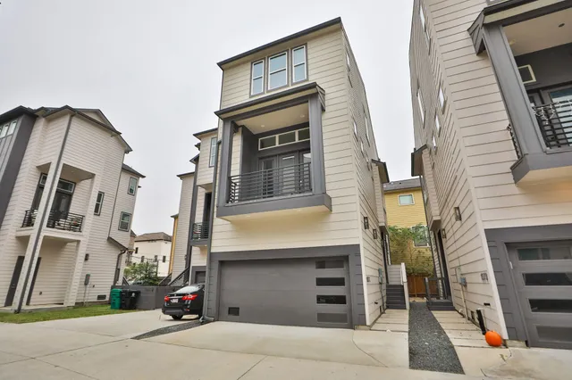 a view of building with car parked