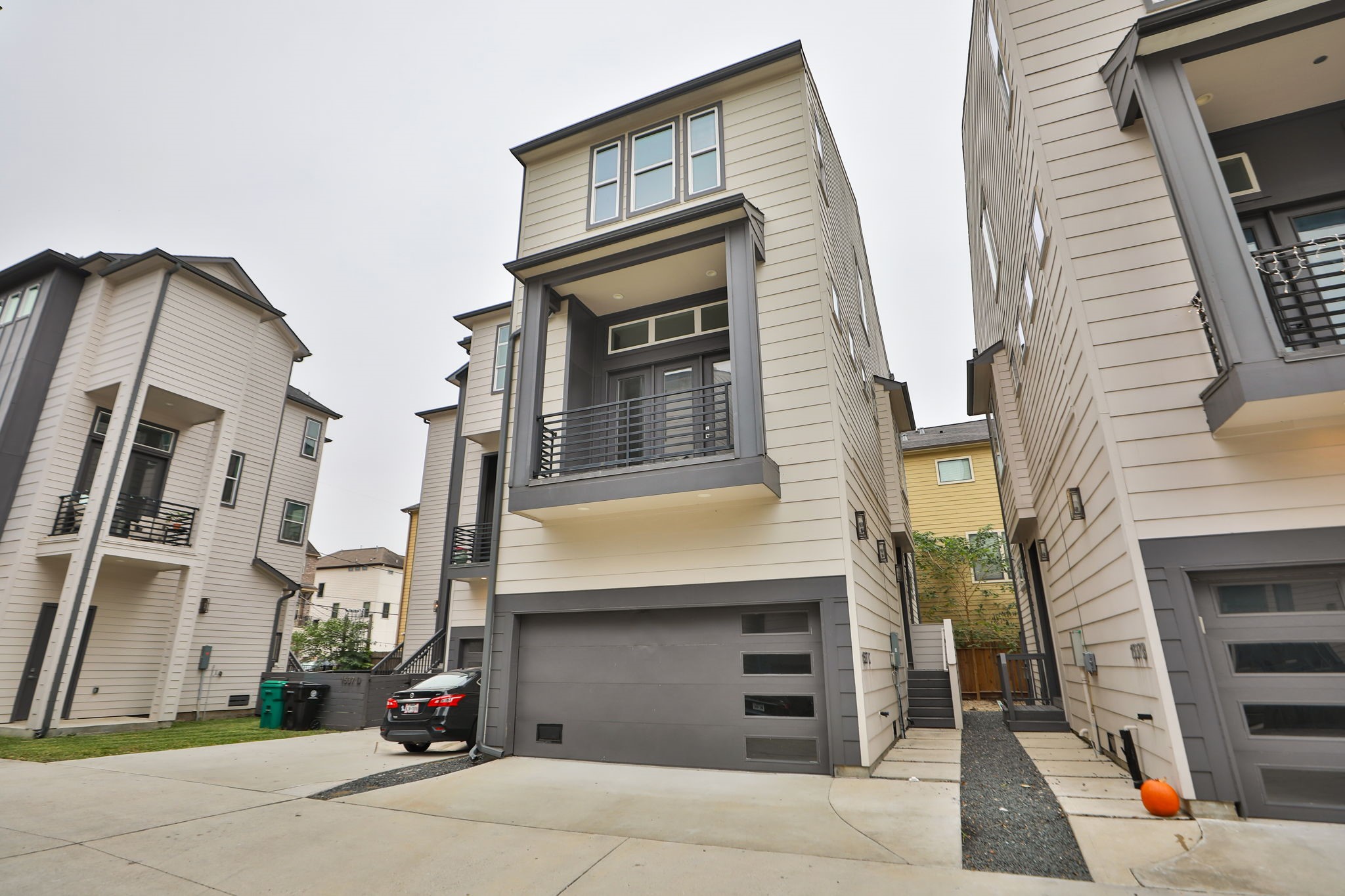 a view of building with car parked