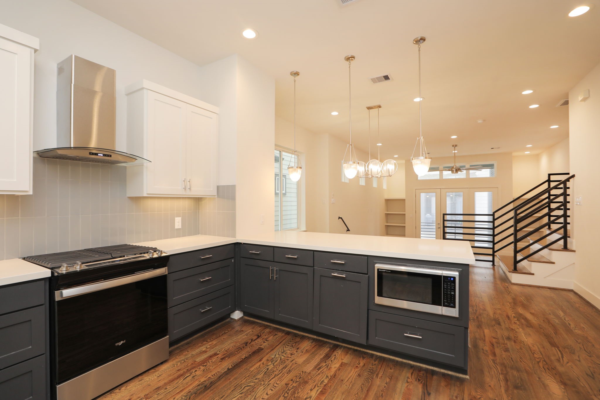 1537 West 24th Street, Unit C Houston, TX 77008 - Photo 14 of 34 a kitchen with a sink and cabinets