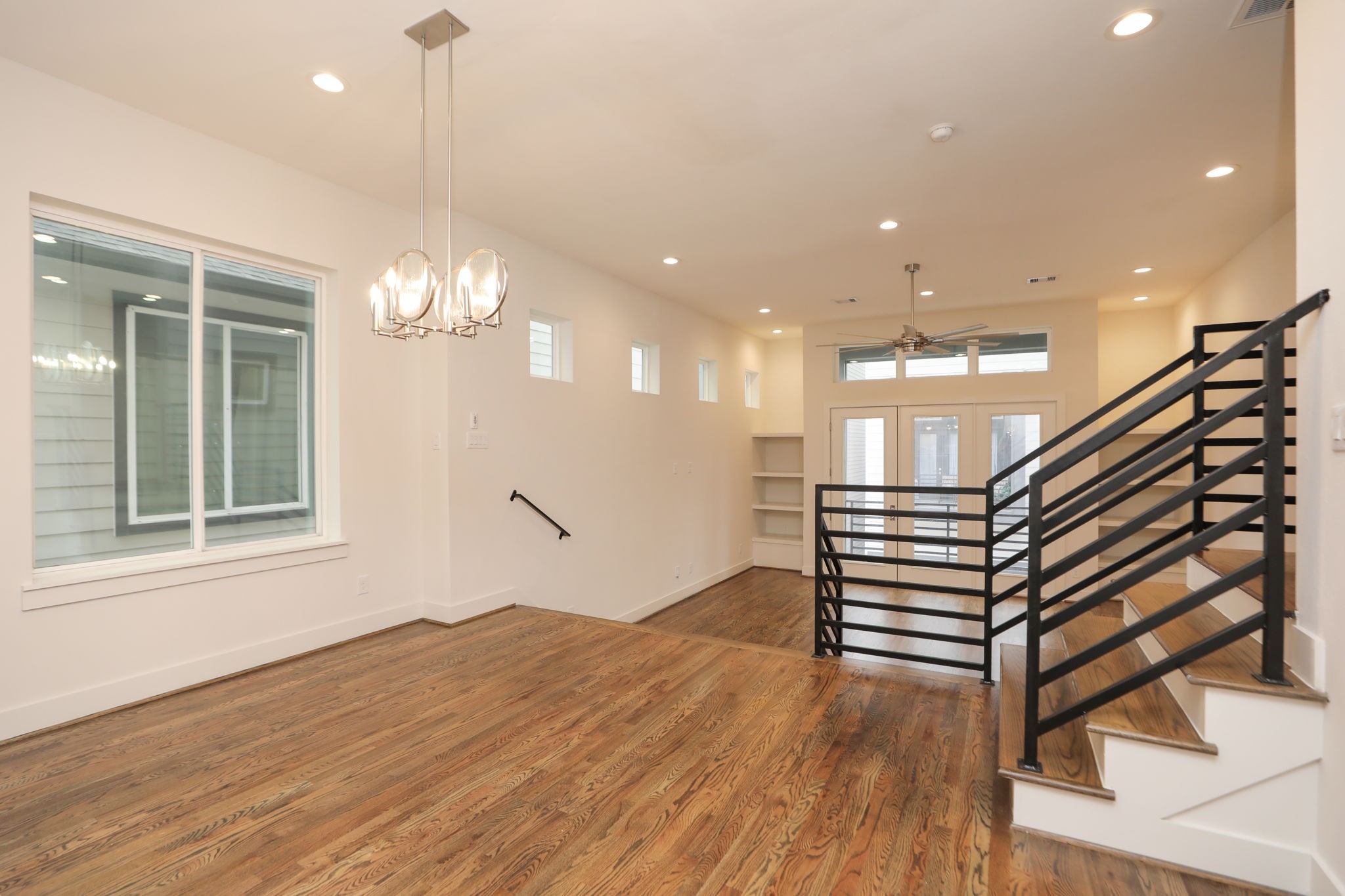 1537 West 24th Street, Unit C Houston, TX 77008 - Photo 15 of 34 a view of entryway and hall with wooden floor