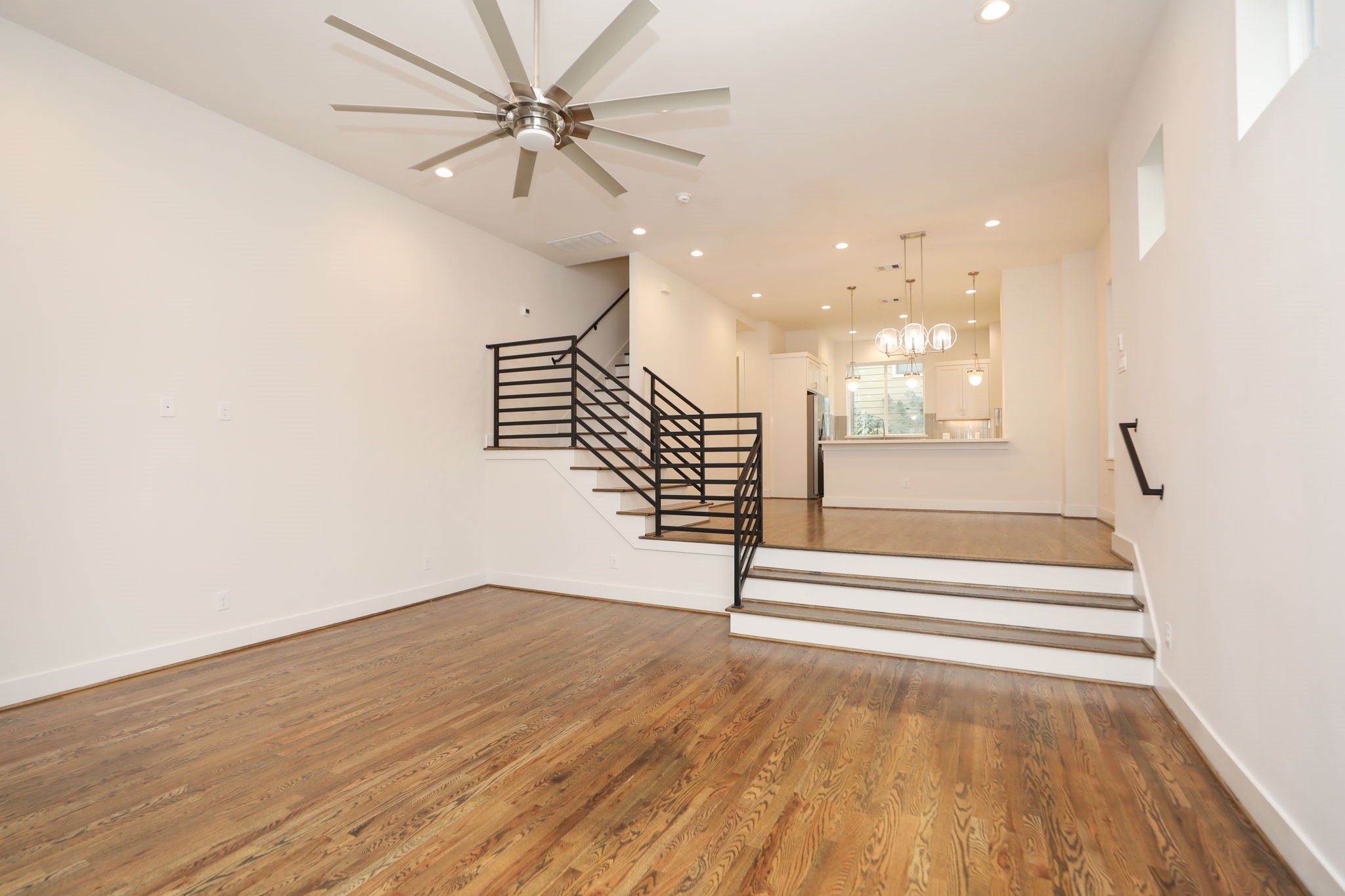 1537 West 24th Street, Unit C Houston, TX 77008 - Photo 18 of 34 a view of entryway and hall with wooden floor