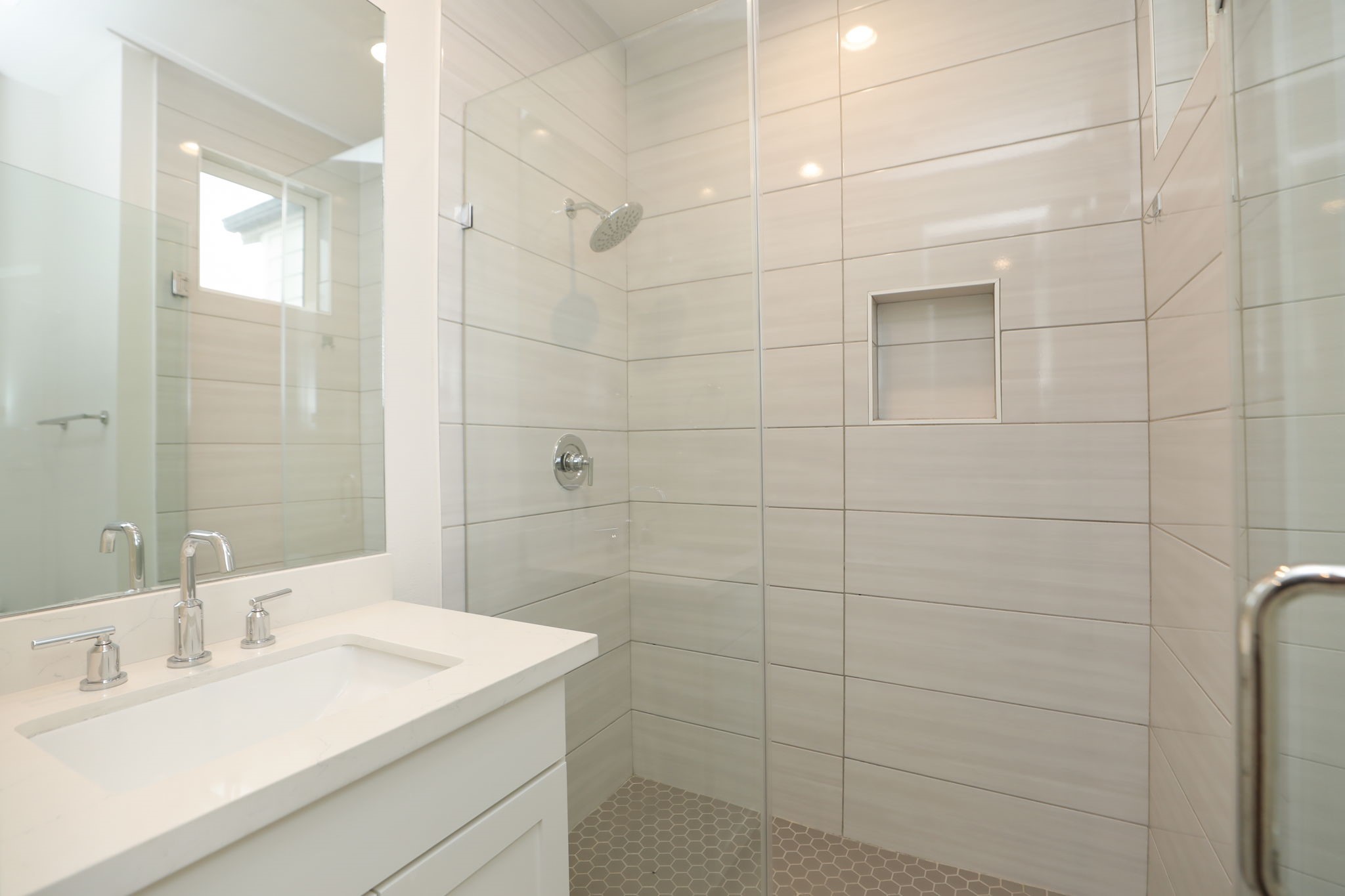 1537 West 24th Street, Unit C Houston, TX 77008 - Photo 22 of 34 a bathroom with a sink shower and a mirror
