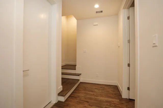 a view of room with wooden floor