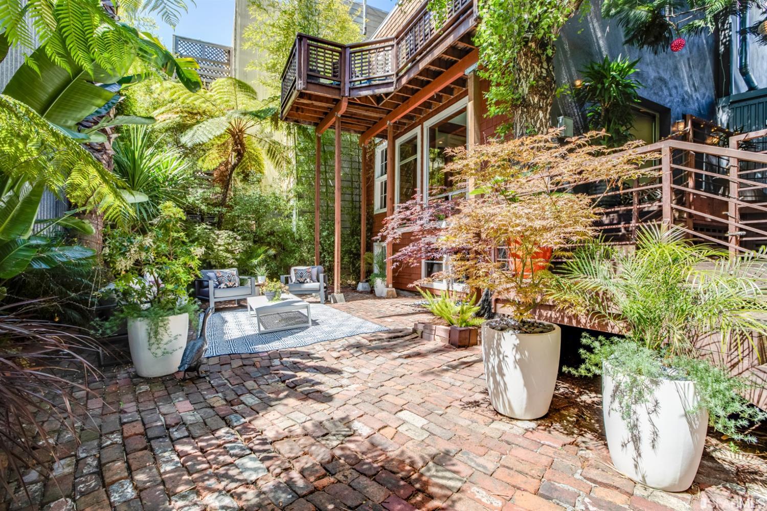 275 Shipley San Francisco, CA 94103 - Photo 25 of 95 a view of a patio with table and chairs and potted plants