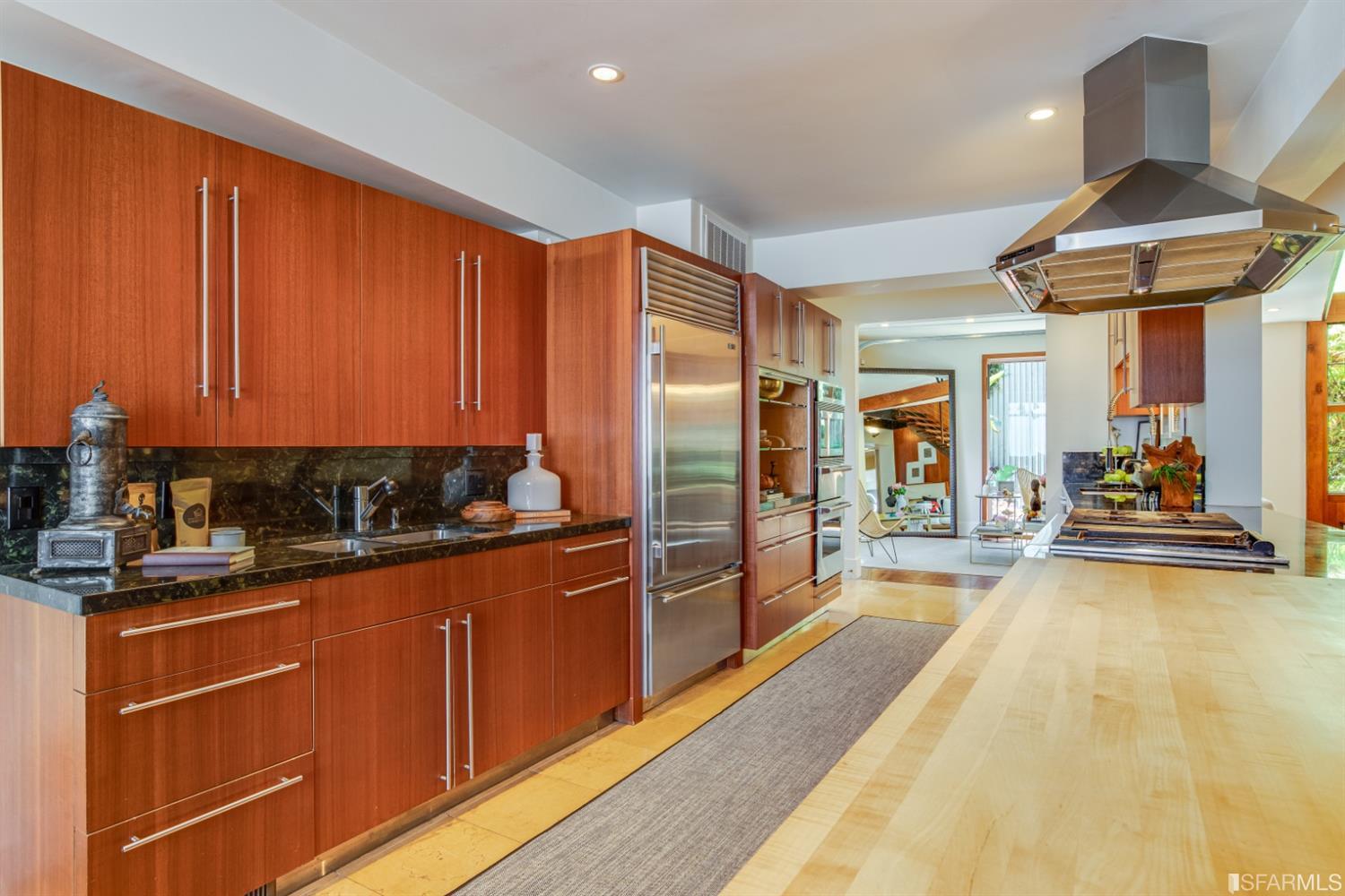 275 Shipley San Francisco, CA 94103 - Photo 41 of 95 a large kitchen with stainless steel appliances granite countertop a stove refrigerator and cabinets