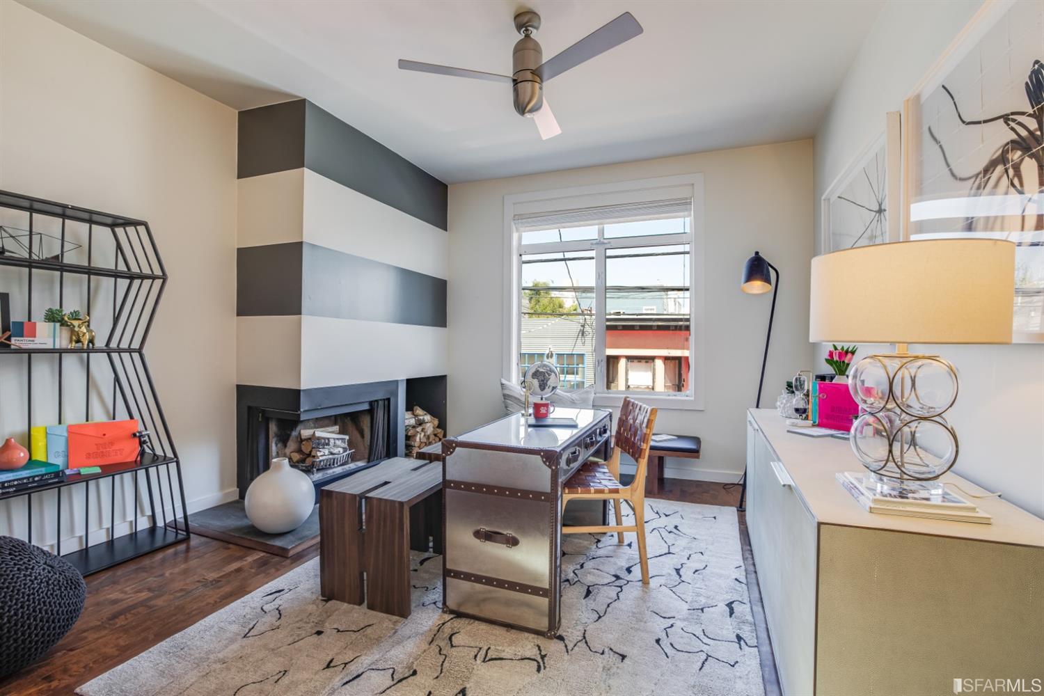 275 Shipley San Francisco, CA 94103 - Photo 61 of 95 a living room with furniture a flat screen tv and a fireplace