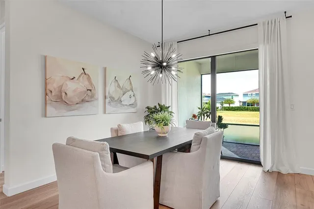 a dining room with furniture and window