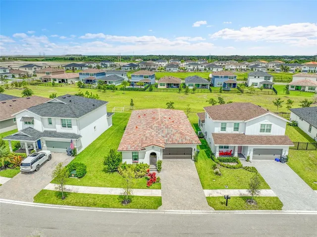 an aerial view of a house with a garden