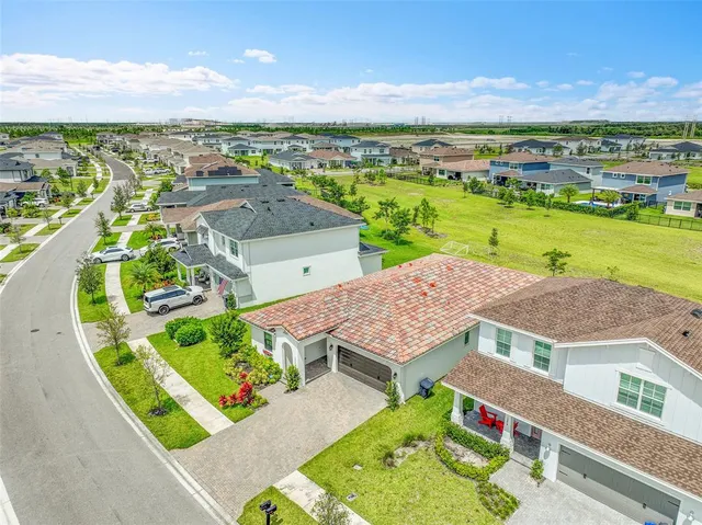 an aerial view of residential houses with outdoor space