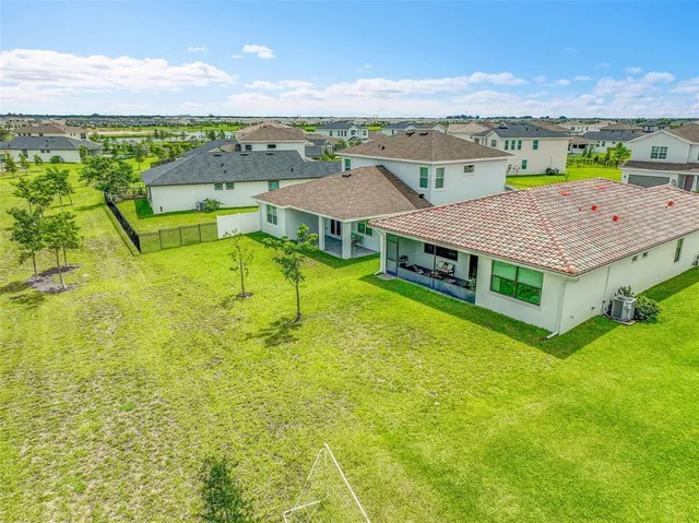 an aerial view of a house with a garden
