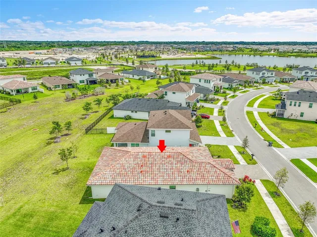 a view of a swimming pool with a yard