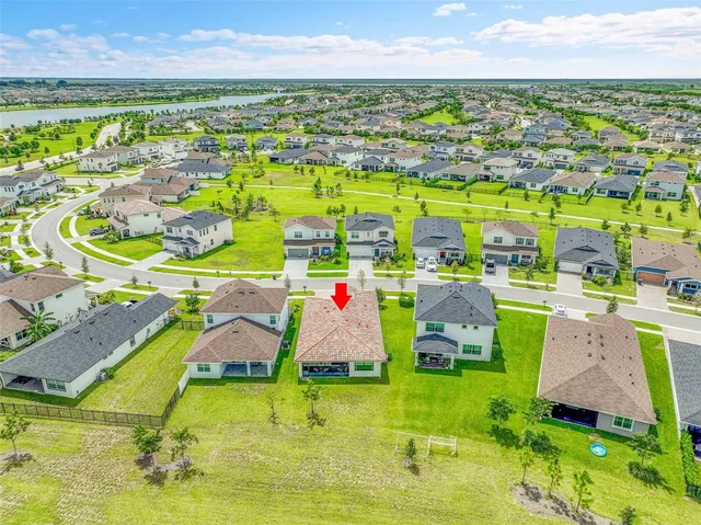 a front view of a building with palm trees