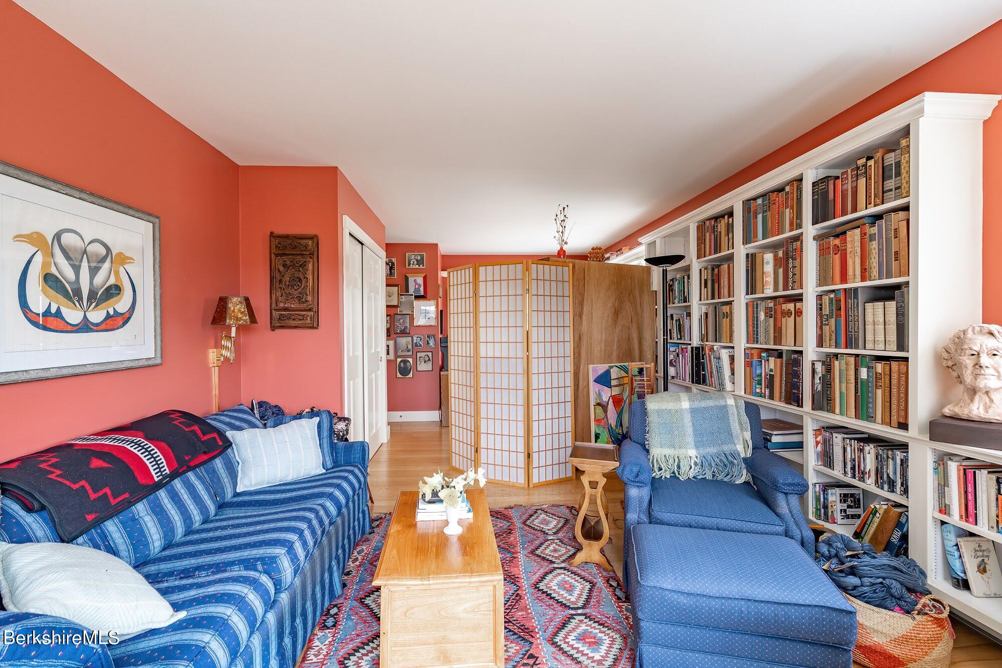78 Mountain Road South Egremont, MA 01258 - Photo 18 of 34 a living room with furniture and a book shelf