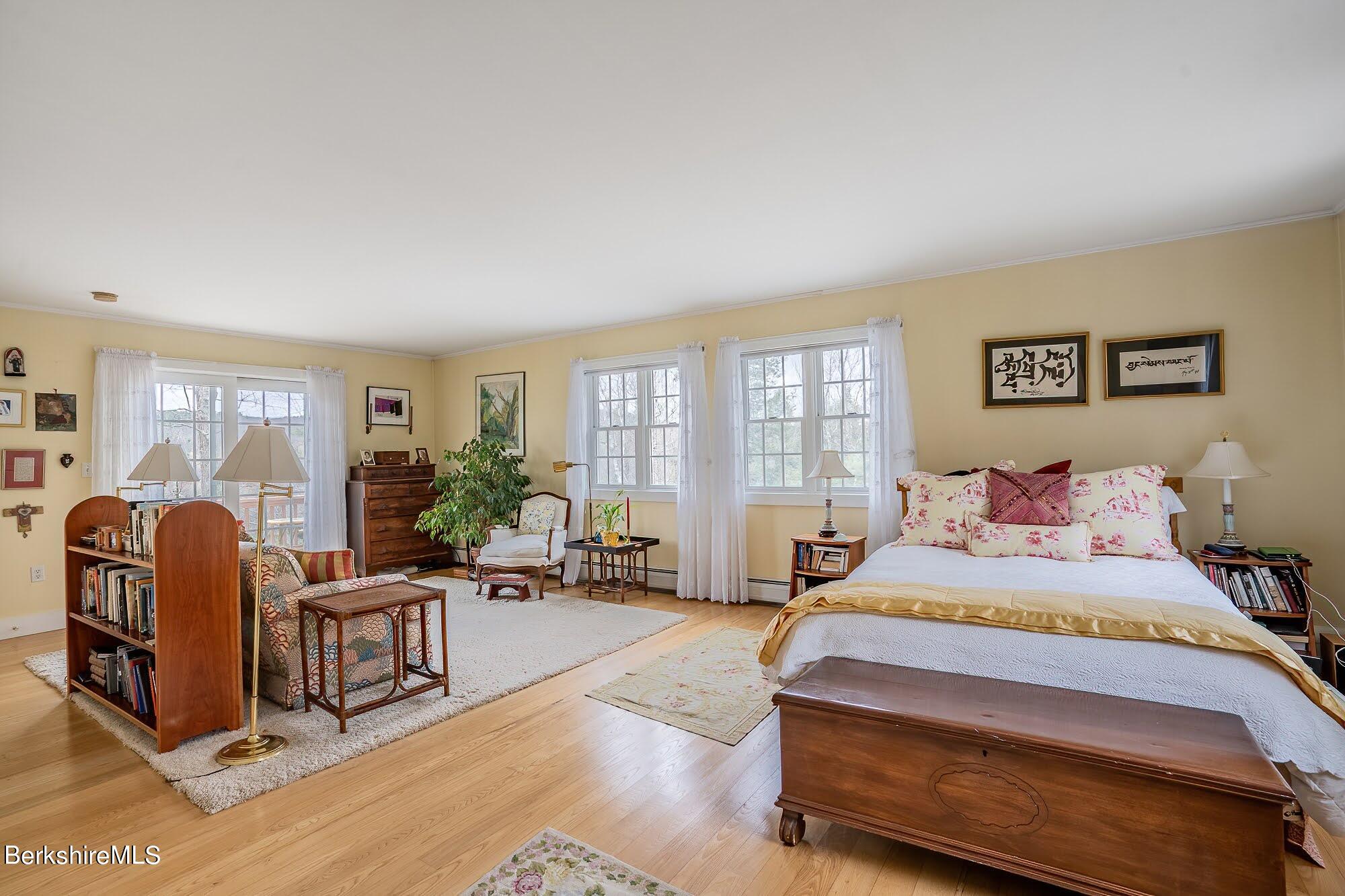 78 Mountain Road South Egremont, MA 01258 - Photo 21 of 34 a bedroom with a bed a table and chair