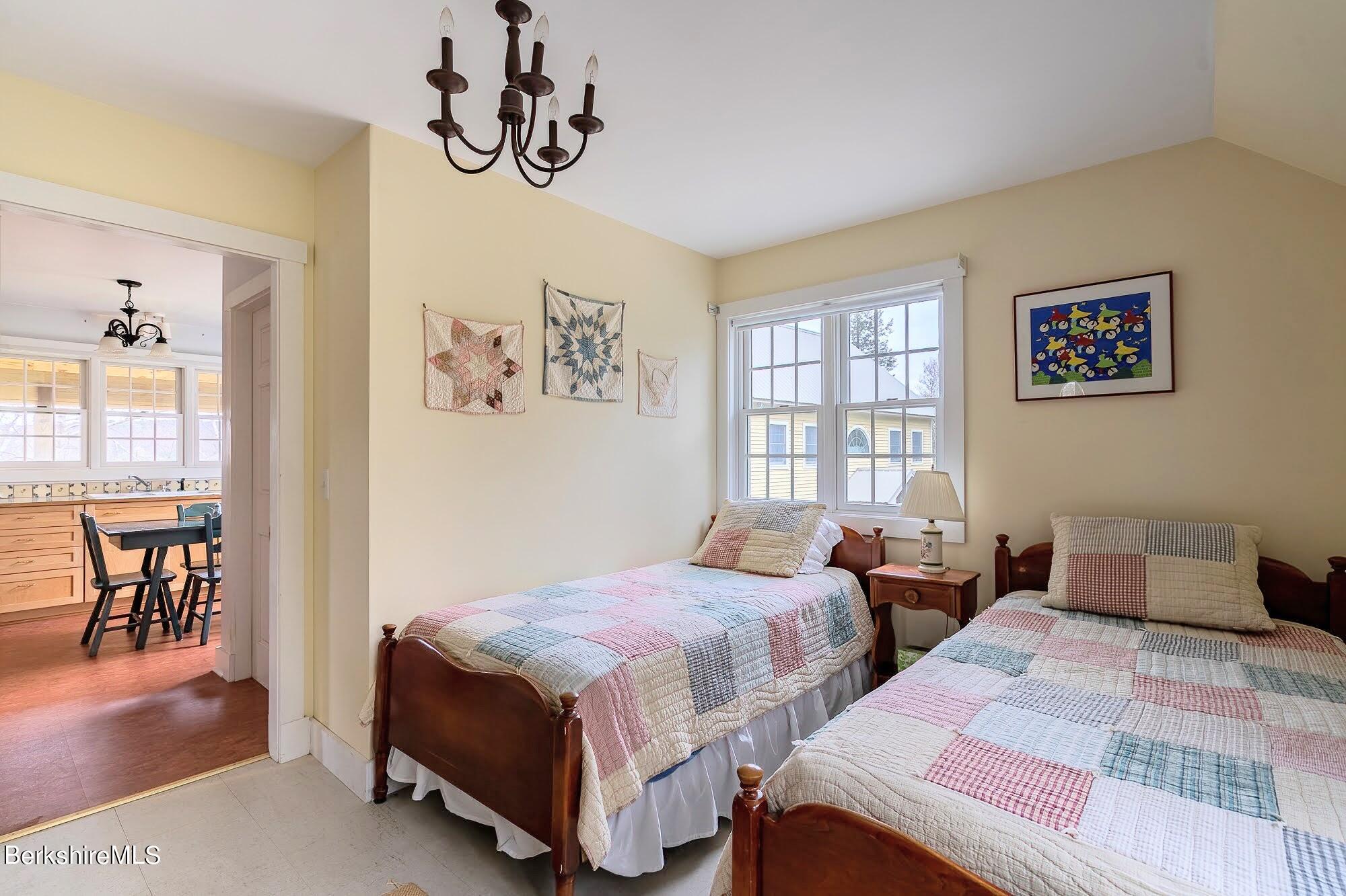 78 Mountain Road South Egremont, MA 01258 - Photo 32 of 34 a bedroom with two beds and a table with rug