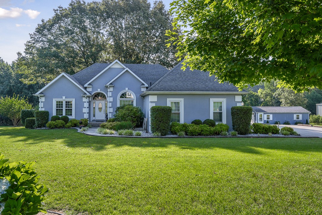 245 Faith-Rae Boulevard Morrison, TN 37357 - Photo 15 of 55 a front view of a house with a yard and garage