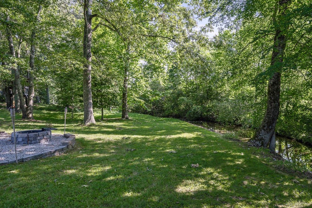245 Faith-Rae Boulevard Morrison, TN 37357 - Photo 32 of 55 a backyard of a house with lots of green space