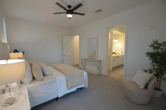 a bathroom with a granite countertop sink a toilet and shower