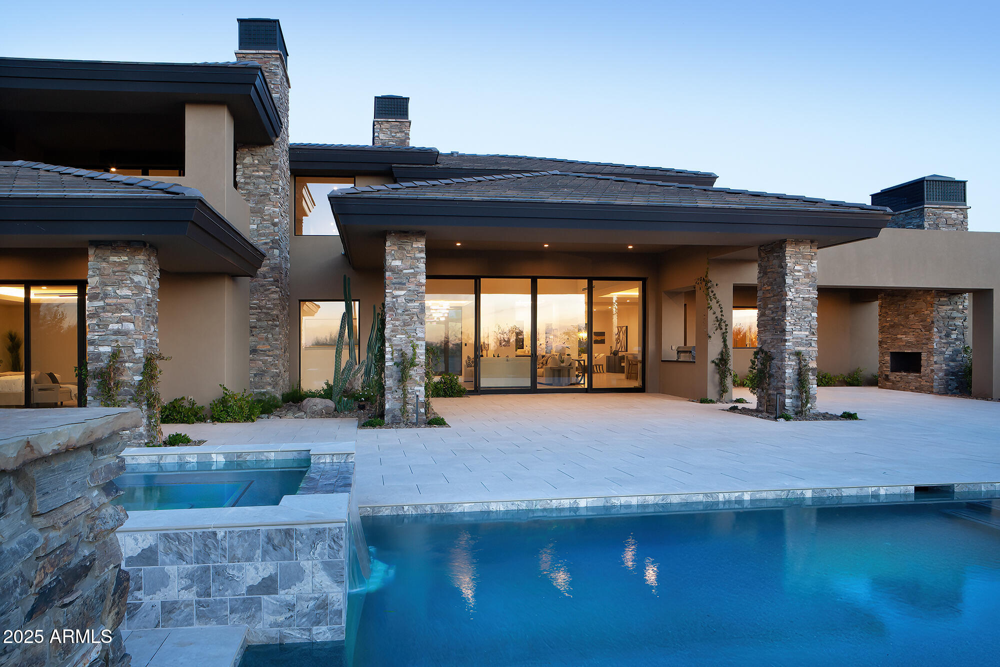 29646 North 109th Place, Unit 128 Scottsdale, AZ 85262 - Photo 2 of 45 a view of living room kitchen with stainless steel appliances granite countertop cabinets and fireplace