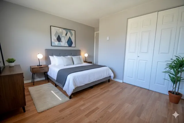 a bedroom with a bed and furniture potted plant