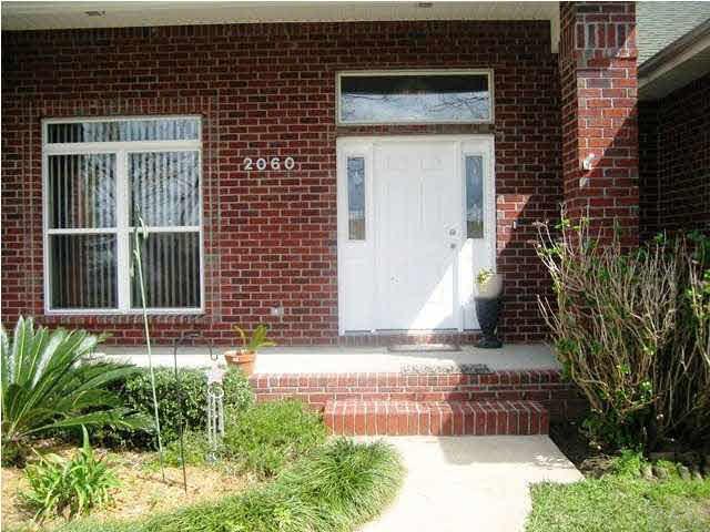 2060 Stallion Road Cantonment, FL 32533 - Photo 3 of 24 SIDE LIGHT FRONT DOOR WITH TRANSOM