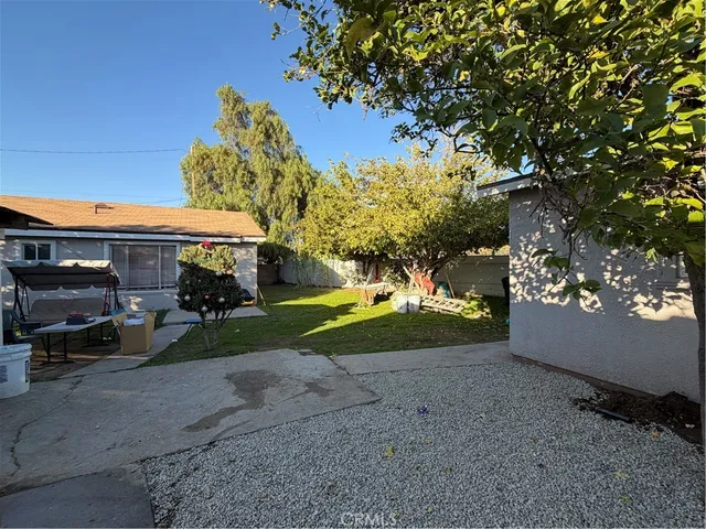 a view of house with outdoor space and parking