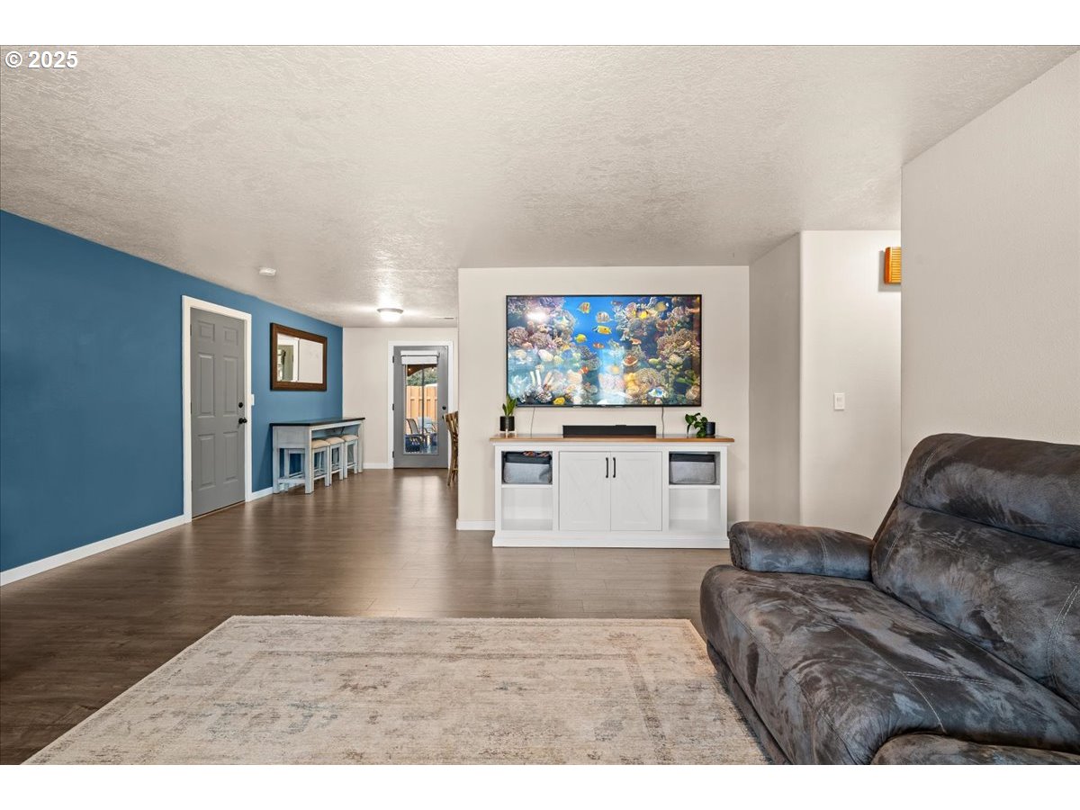 2788 South Beech Street Cornelius, OR 97113 - Photo 11 of 40 a living room with furniture and a flat screen tv
