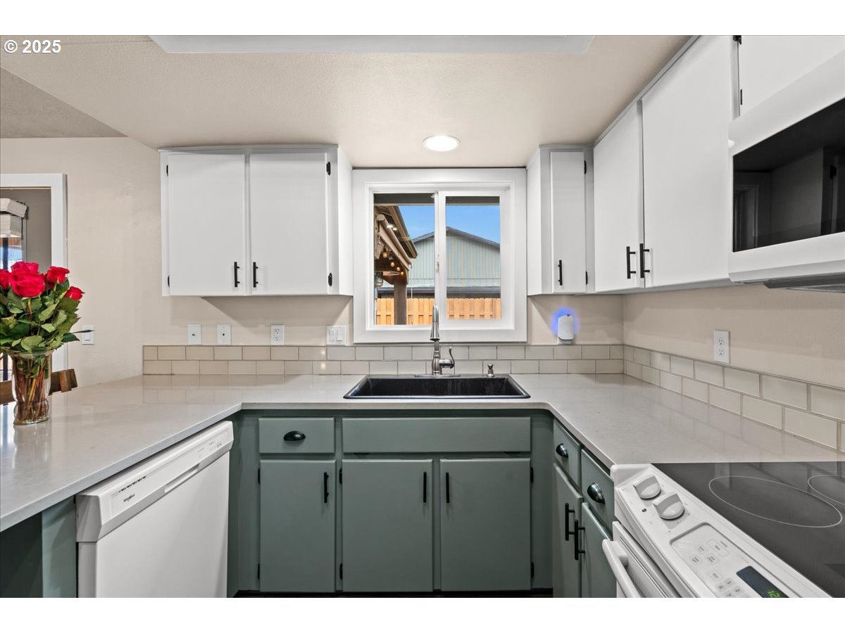 2788 South Beech Street Cornelius, OR 97113 - Photo 17 of 40 a kitchen with a sink cabinets and window