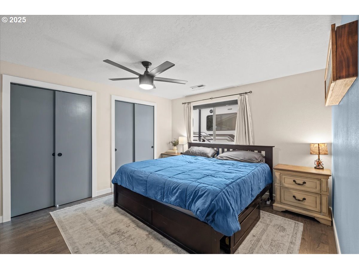 2788 South Beech Street Cornelius, OR 97113 - Photo 20 of 40 a bedroom with a bed and a chandelier