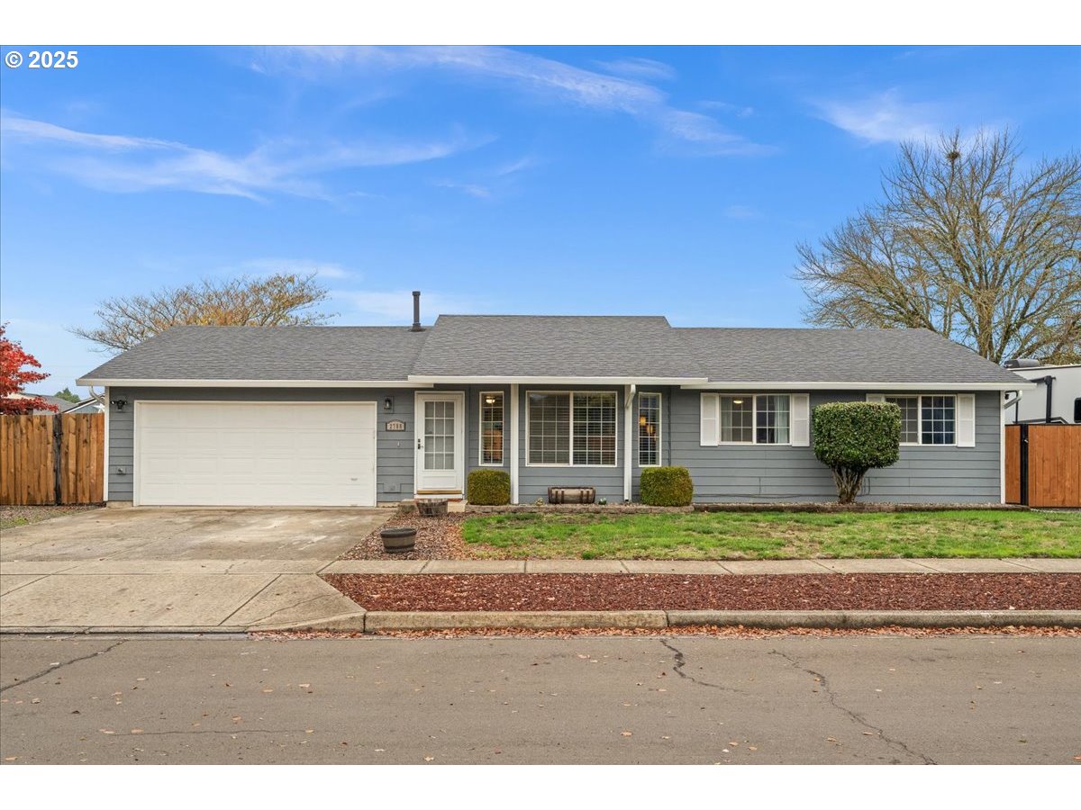 2788 South Beech Street Cornelius, OR 97113 - Photo 2 of 40 a front view of a house with a yard and outdoor seating