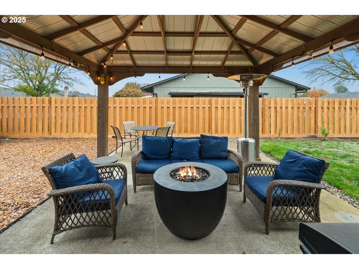 2788 South Beech Street Cornelius, OR 97113 - Photo 28 of 40 a view of a chairs and table in the back yard of the house