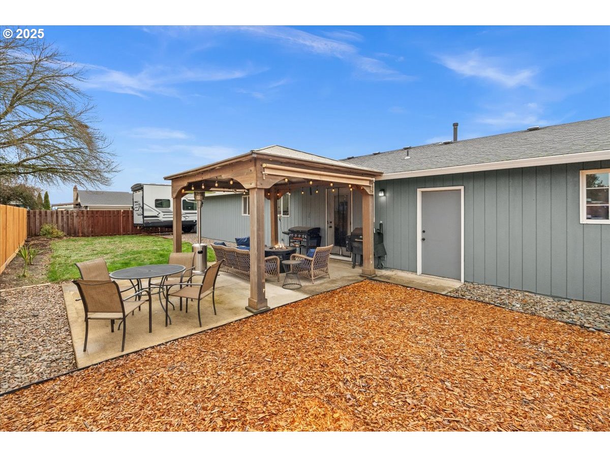 2788 South Beech Street Cornelius, OR 97113 - Photo 29 of 40 a backyard of a house with table and chairs