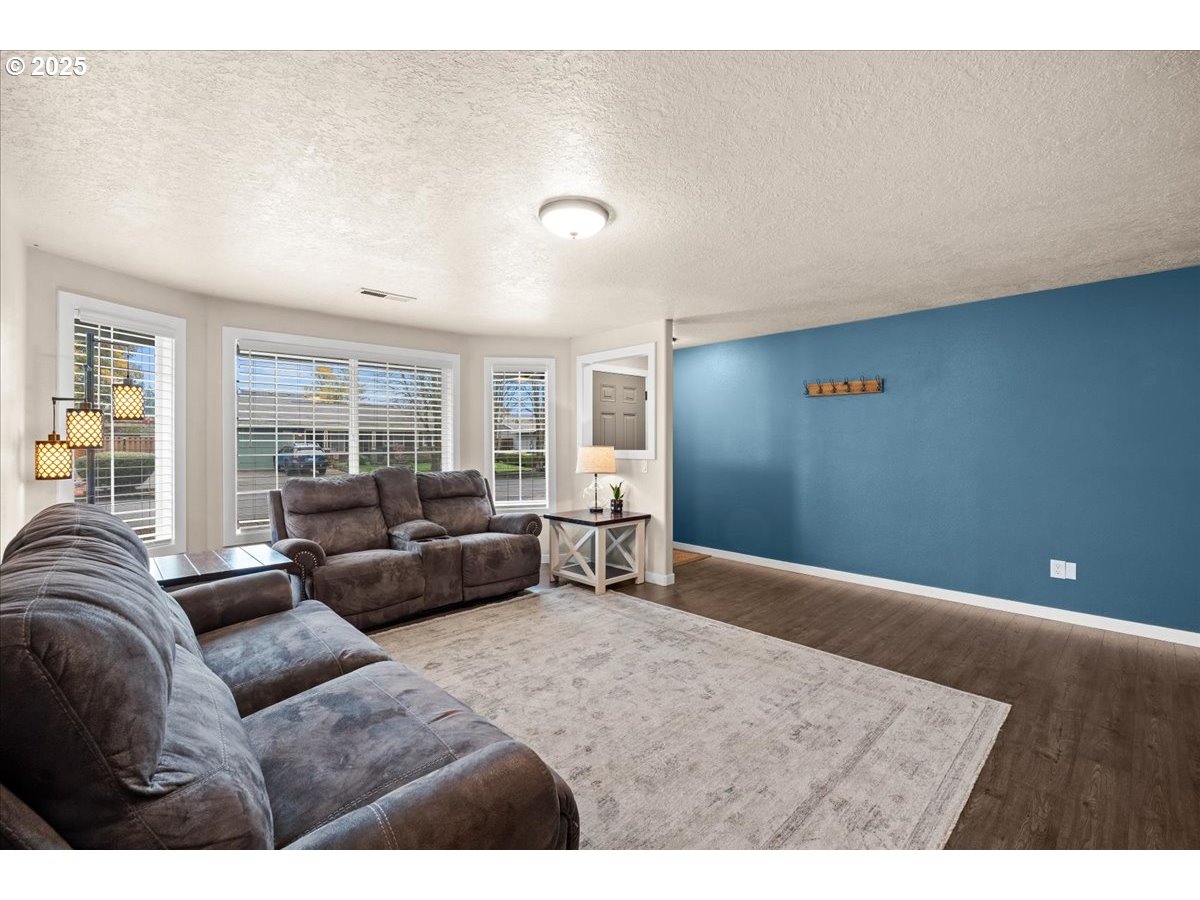 2788 South Beech Street Cornelius, OR 97113 - Photo 9 of 40 a living room with furniture and a large window