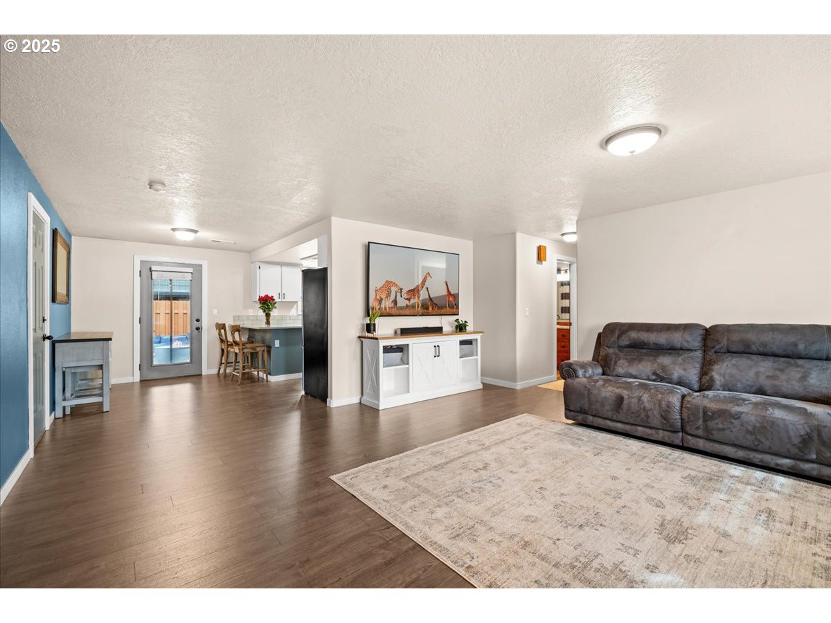 2788 South Beech Street Cornelius, OR 97113 - Photo 10 of 40 a living room with furniture and a kitchen view