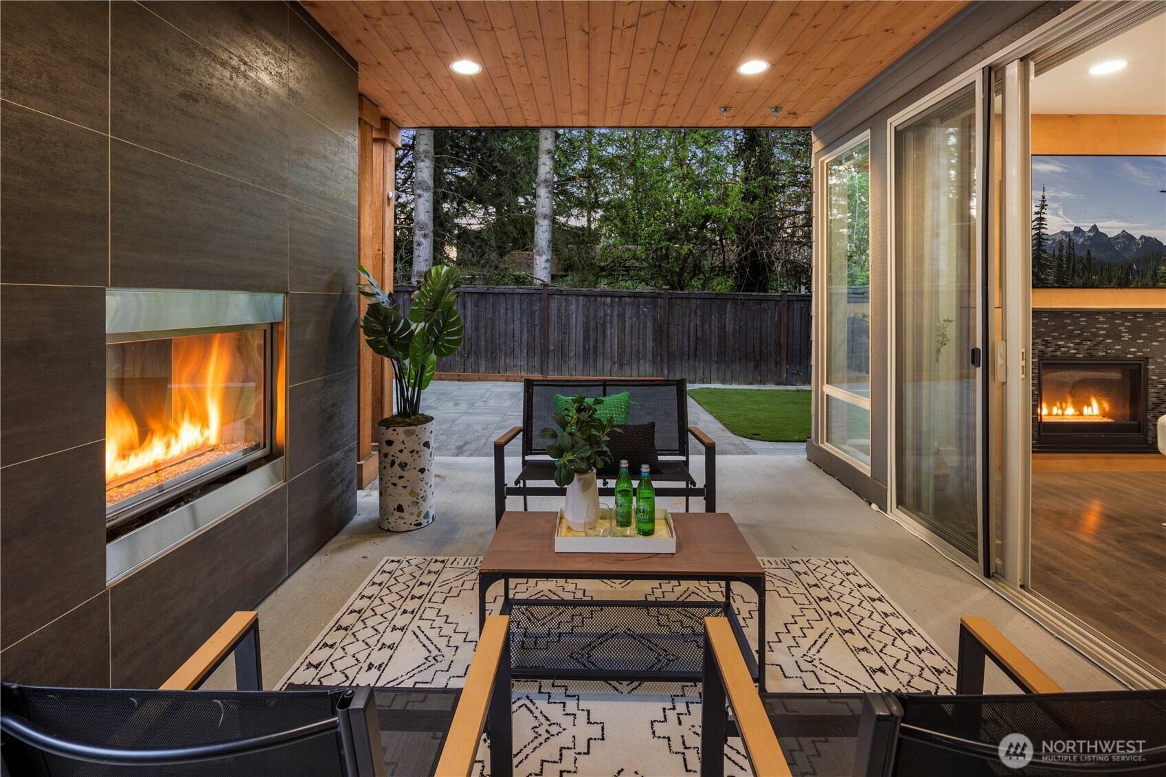 21 226th Place Southwest Bothell, WA 98021 - Photo 5 of 5 a view of a patio with table and chairs potted plants with wooden floor