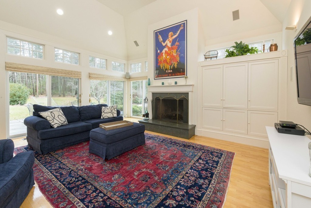 144 Sandy Pond Road Lincoln, MA 01773 - Photo 12 of 30 a living room with furniture and a fireplace