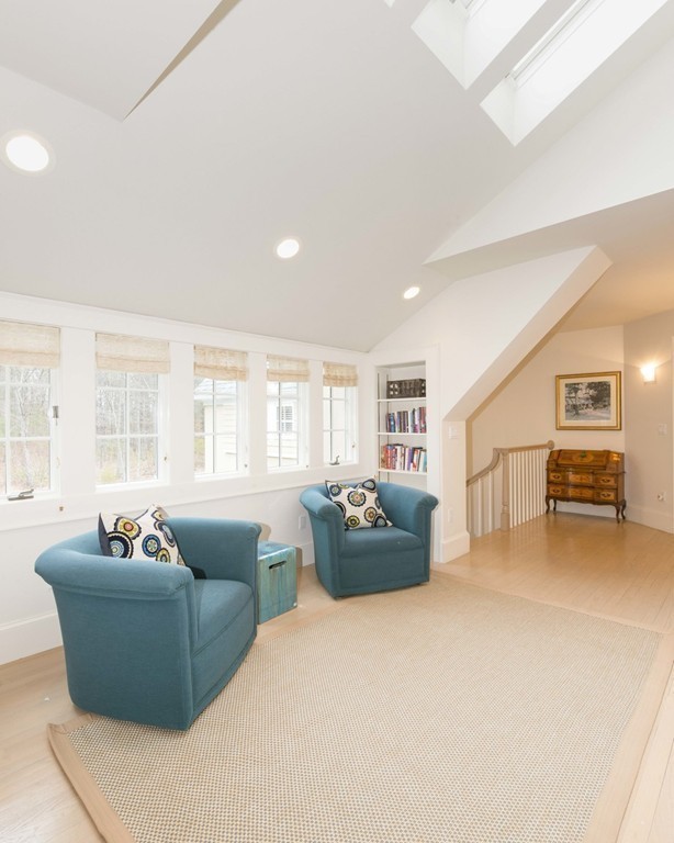 144 Sandy Pond Road Lincoln, MA 01773 - Photo 15 of 30 a living room with furniture and a flat screen tv