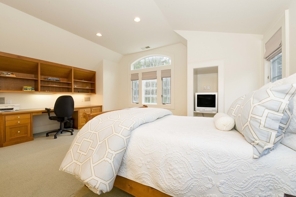 144 Sandy Pond Road Lincoln, MA 01773 - Photo 17 of 30 a bedroom with a bed and wooden floor