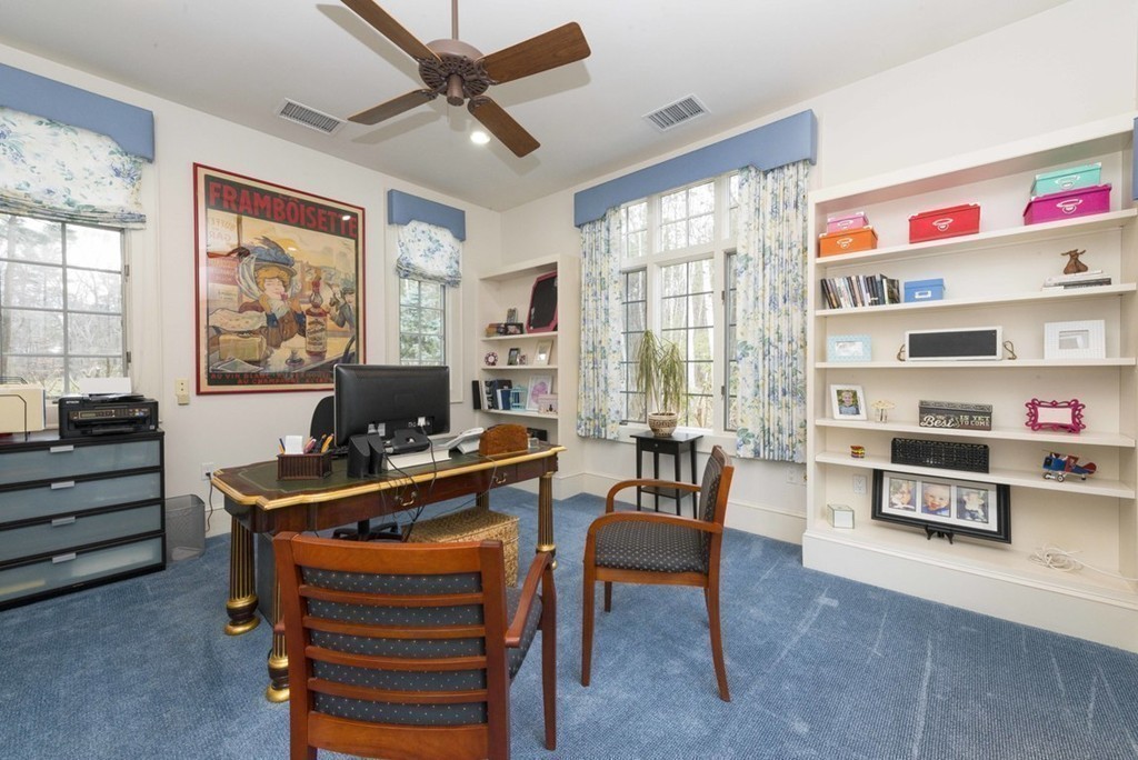 144 Sandy Pond Road Lincoln, MA 01773 - Photo 21 of 30 a room with furniture and a chandelier