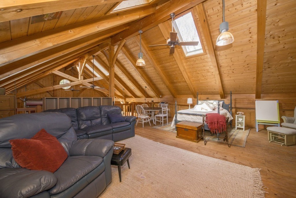 144 Sandy Pond Road Lincoln, MA 01773 - Photo 25 of 30 a living room with furniture and a window