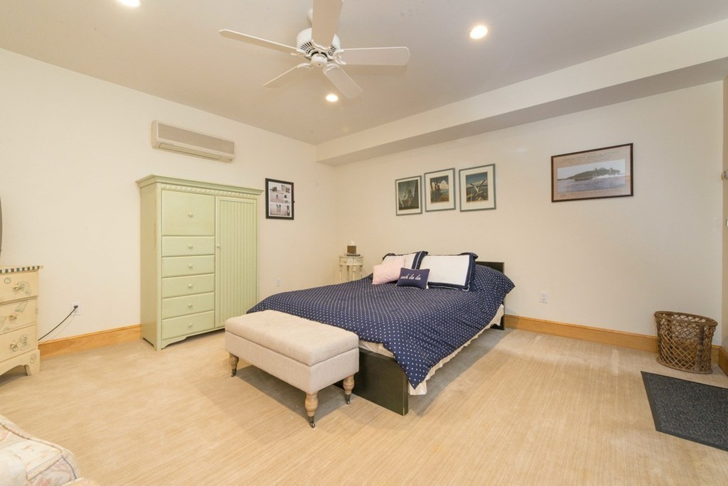 144 Sandy Pond Road Lincoln, MA 01773 - Photo 26 of 30 a spacious bedroom with a bed and furniture