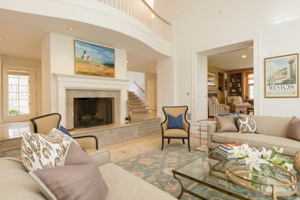144 Sandy Pond Road Lincoln, MA 01773 - Photo 7 of 30 a living room with furniture and a fireplace