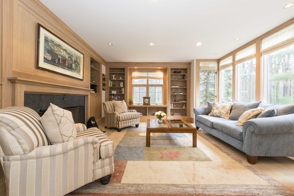 144 Sandy Pond Road Lincoln, MA 01773 - Photo 8 of 30 a living room with furniture large windows and wooden floor