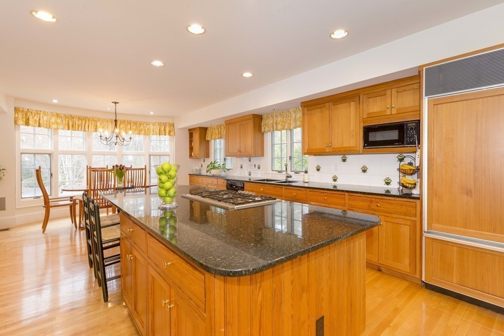 144 Sandy Pond Road Lincoln, MA 01773 - Photo 10 of 30 a kitchen with stainless steel appliances granite countertop sink stove refrigerator and cabinets