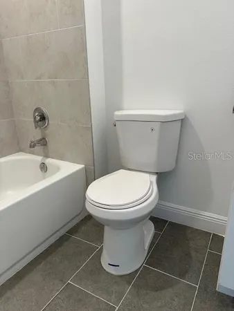 a bathroom with a toilet and a sink