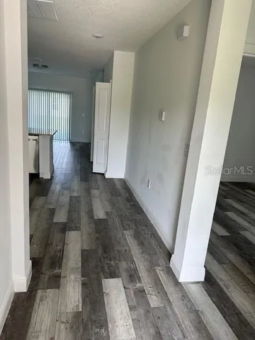 a view of entryway with wooden floor