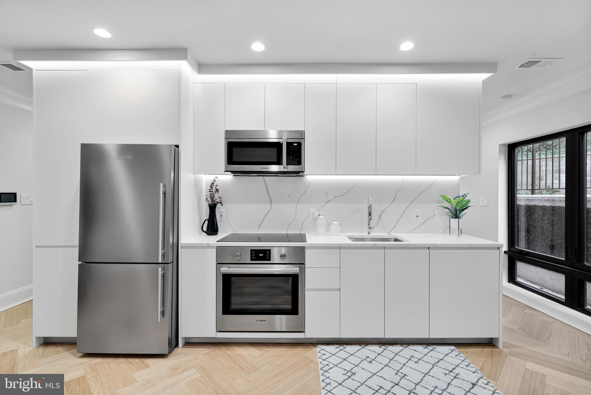 2630 39th Street Northwest, Unit 1 Washington, DC 20007 - Photo 7 of 22 Sleek White Kitchen
