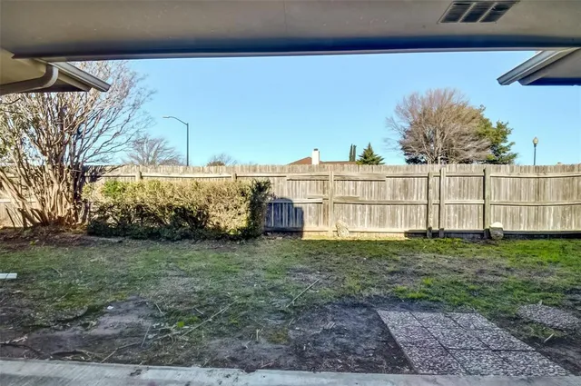 a view of backyard with green space