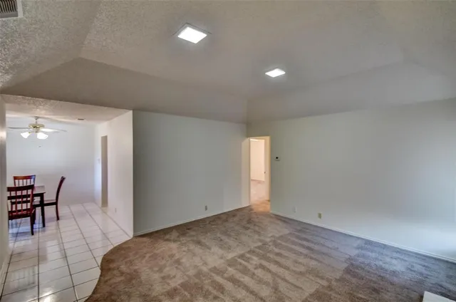 a view of a livingroom with furniture and dining room