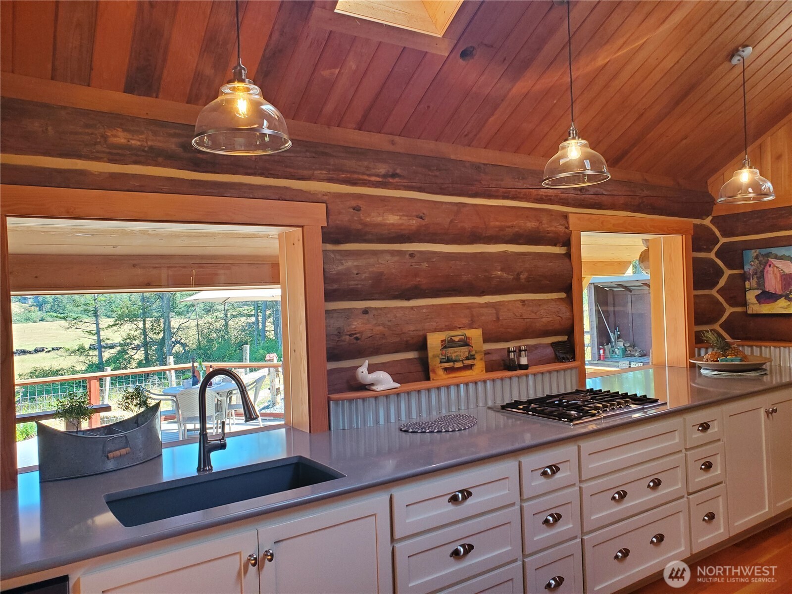 4263 Orcas Road Orcas Island, WA 98245 - Photo 13 of 39 a open kitchen with stainless steel appliances granite countertop a sink a stove and a wooden cabinets